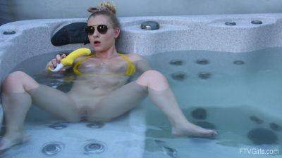 Sweet blonde inserts big dildo in her shaved pussy while in the pool - hellporno.com